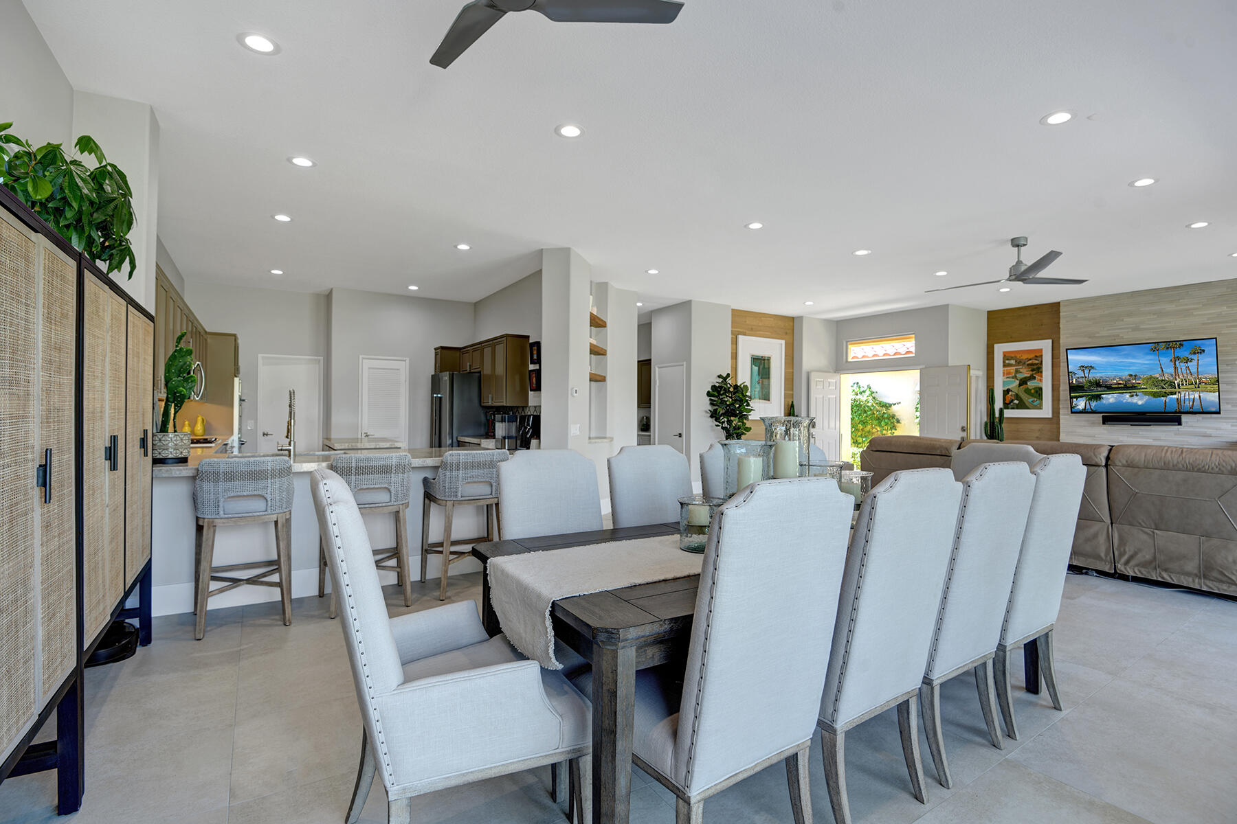 75 North Kavenish Drive Rancho Mirage, CA 92270 - Photo 9 of 41 a living room with furniture a dining table and kitchen view