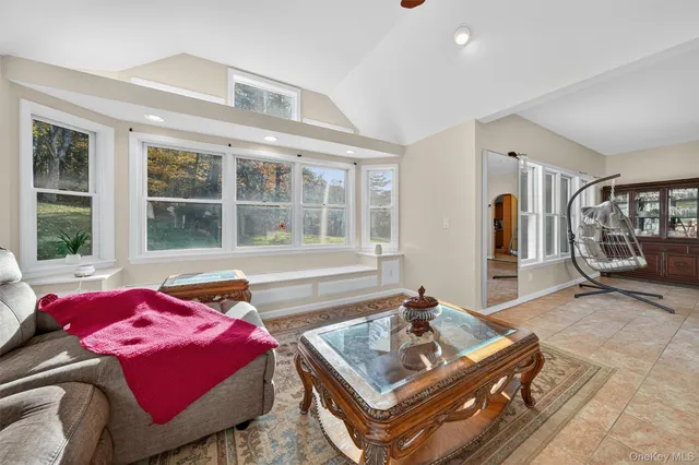 a bedroom with furniture and window