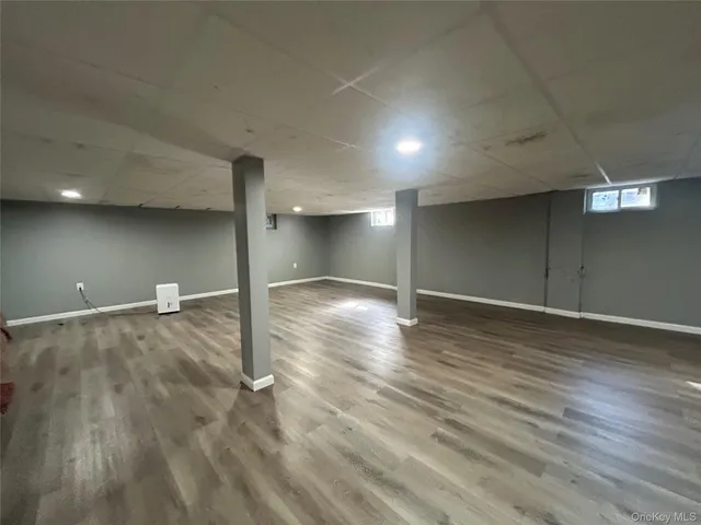 a view of a livingroom with an empty space and a window