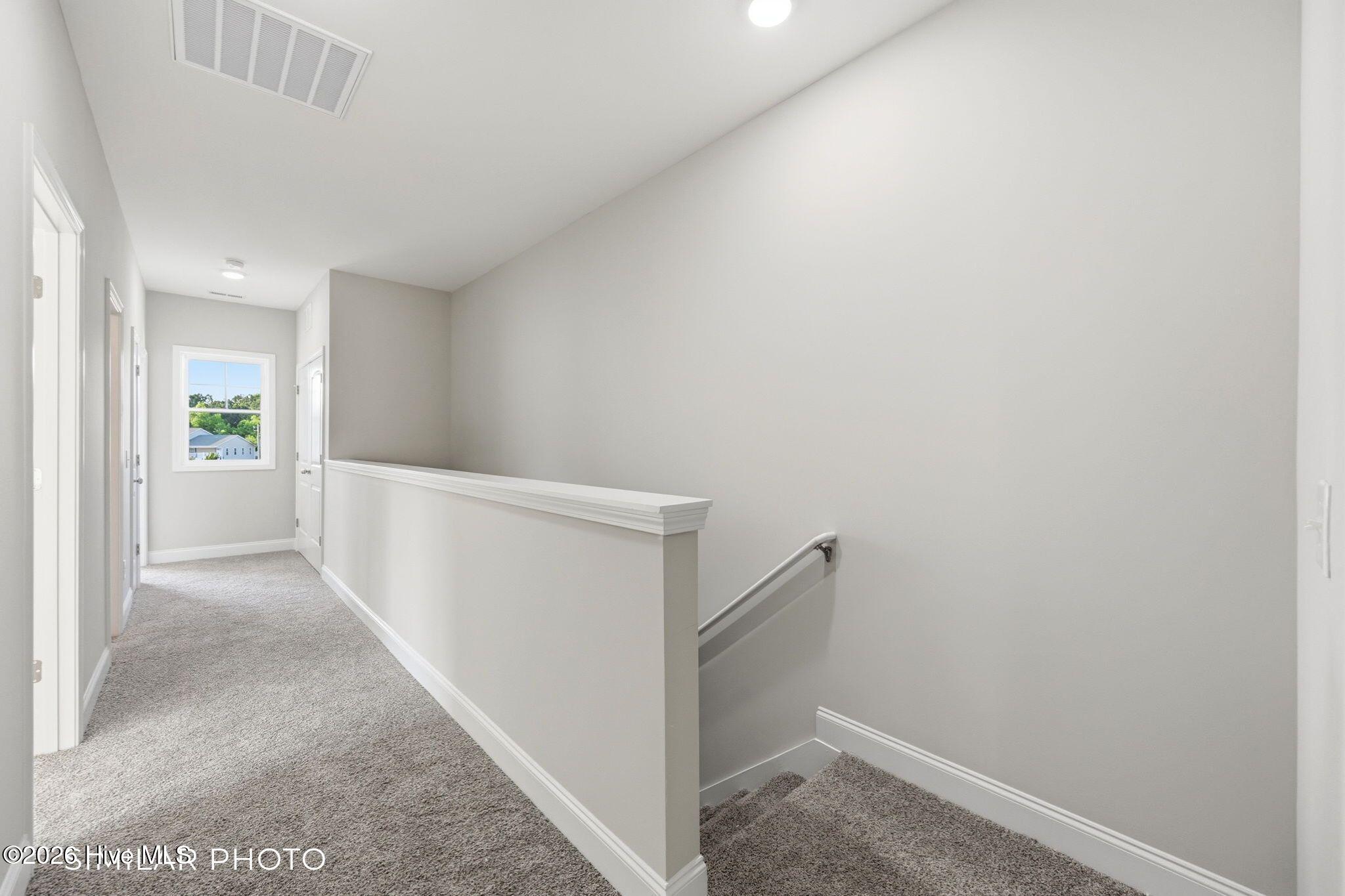 207 Holly Sands Loop Sneads Ferry, NC 28460 - Photo 27 of 45 Similar Photo - Upstairs Hallway