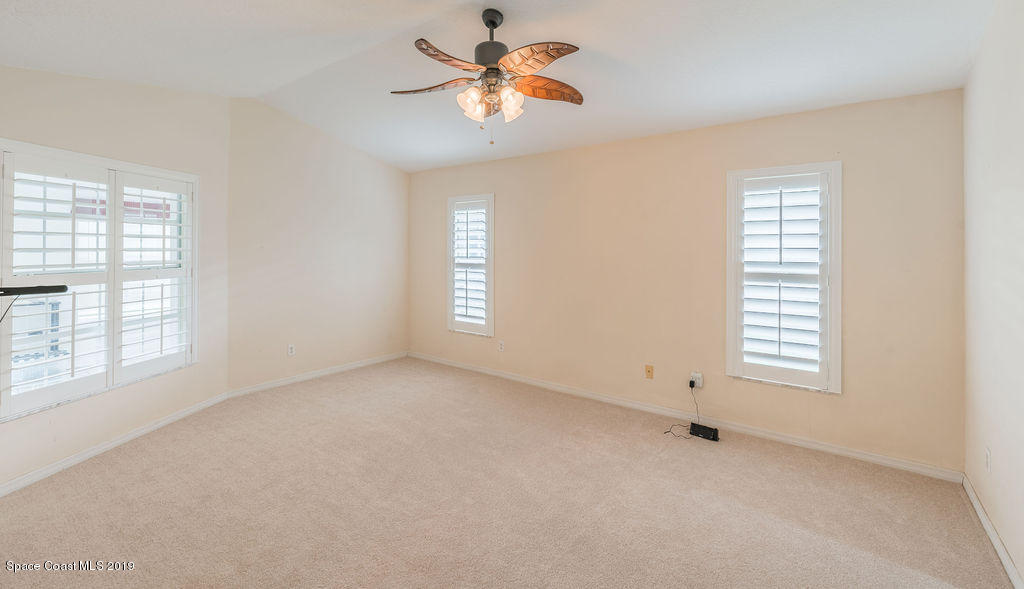 1256 Winding Meadows Road Rockledge, FL 32955 - Photo 11 of 23 a view of an empty room with a window