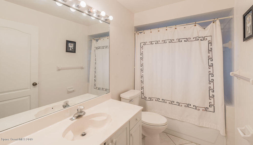 1256 Winding Meadows Road Rockledge, FL 32955 - Photo 15 of 23 a bathroom with a sink toilet and shower