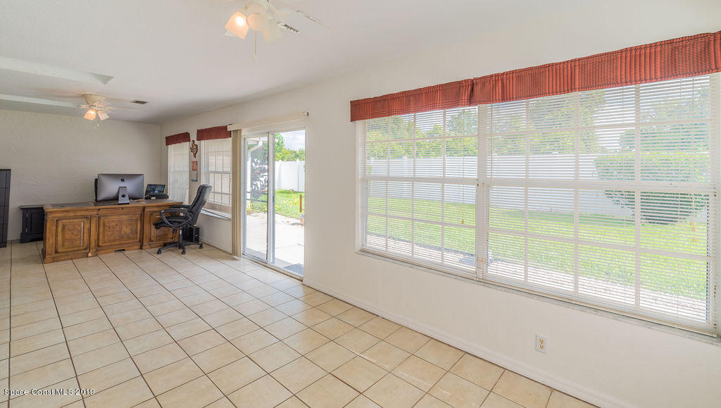 1256 Winding Meadows Road Rockledge, FL 32955 - Photo 18 of 23 a living room with a large window