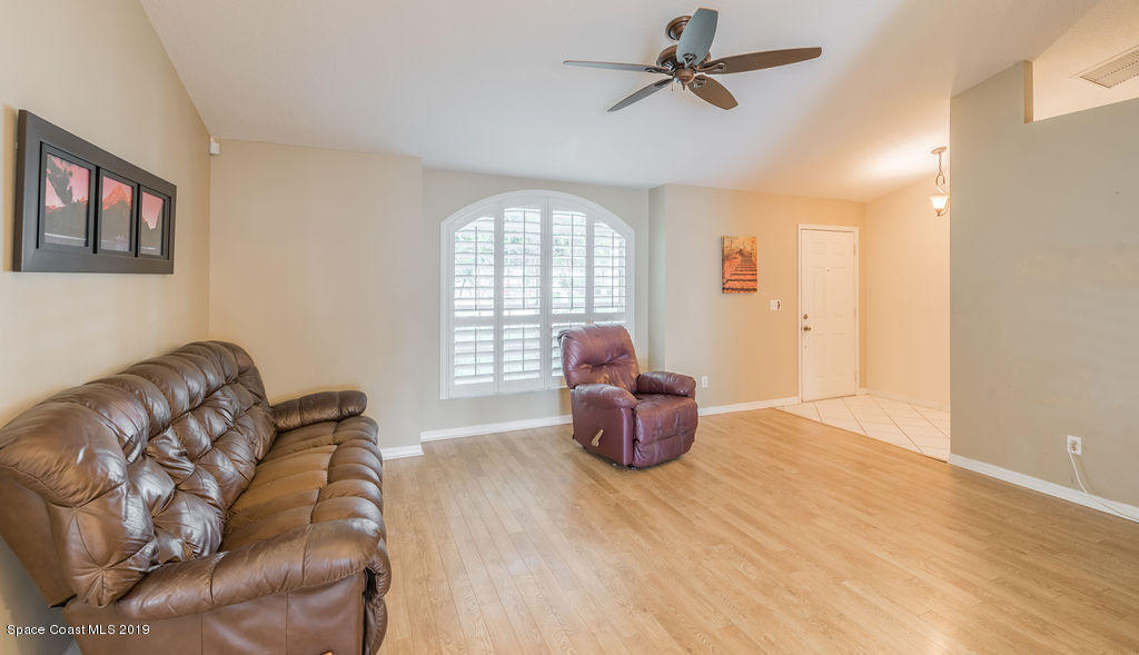 1256 Winding Meadows Road Rockledge, FL 32955 - Photo 3 of 23 a living room with furniture