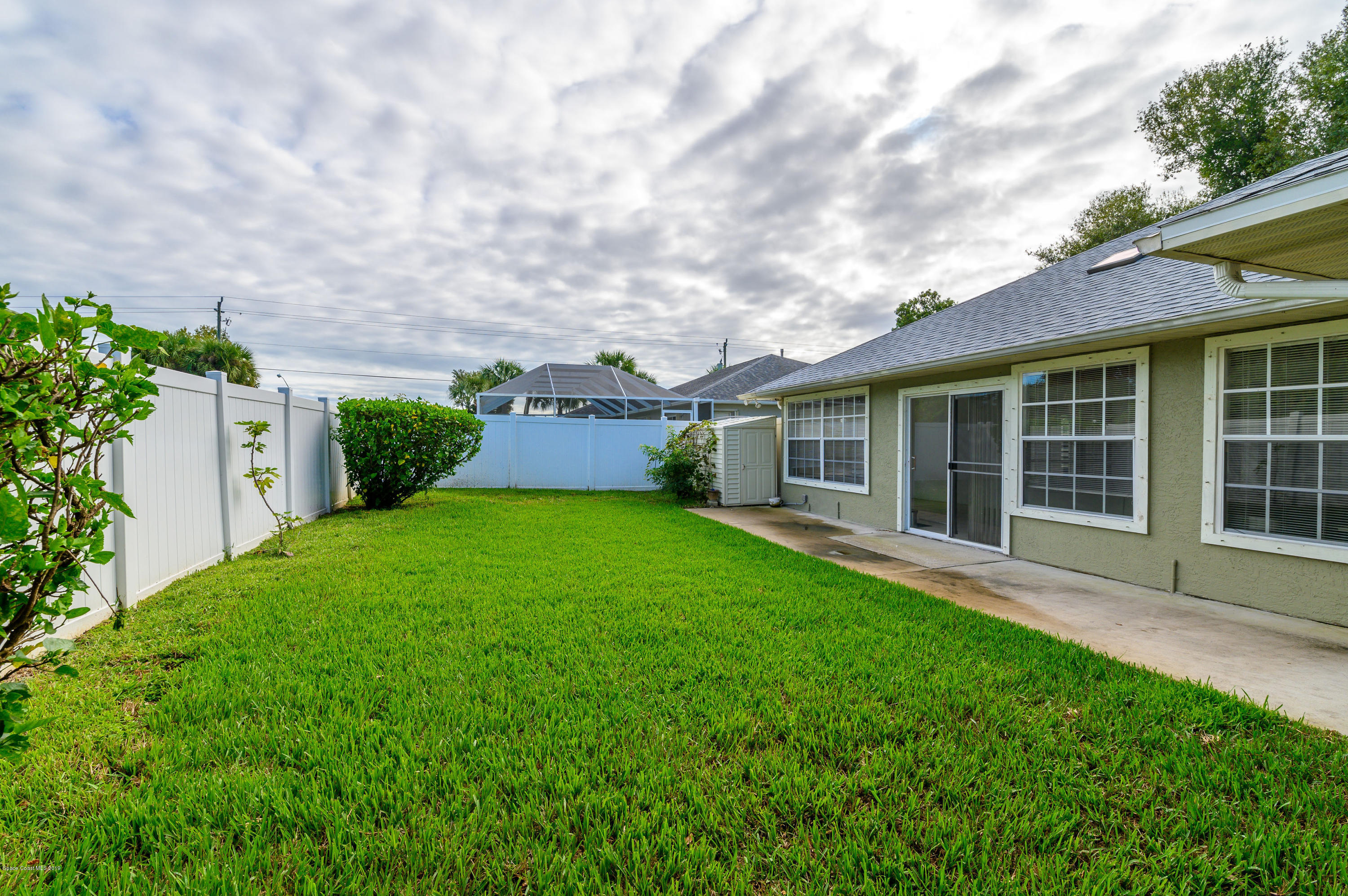 1256 Winding Meadows Road Rockledge, FL 32955 - Photo 21 of 23 front view of a house with a yard