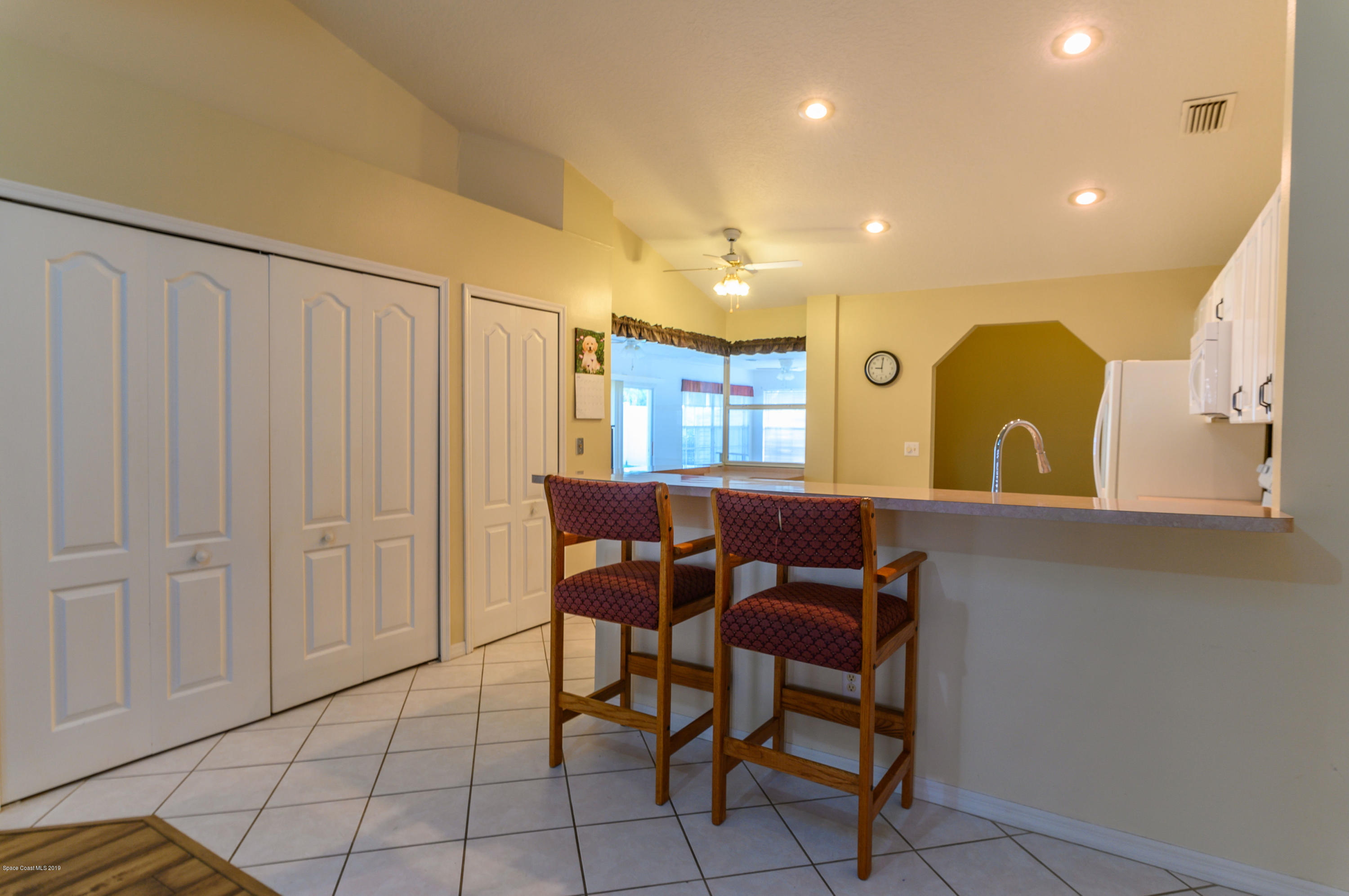 1256 Winding Meadows Road Rockledge, FL 32955 - Photo 6 of 23 a view of a dining room with furniture and chandelier