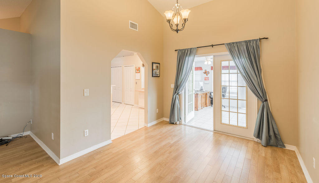 1256 Winding Meadows Road Rockledge, FL 32955 - Photo 10 of 23 a view of an entryway with wooden floor