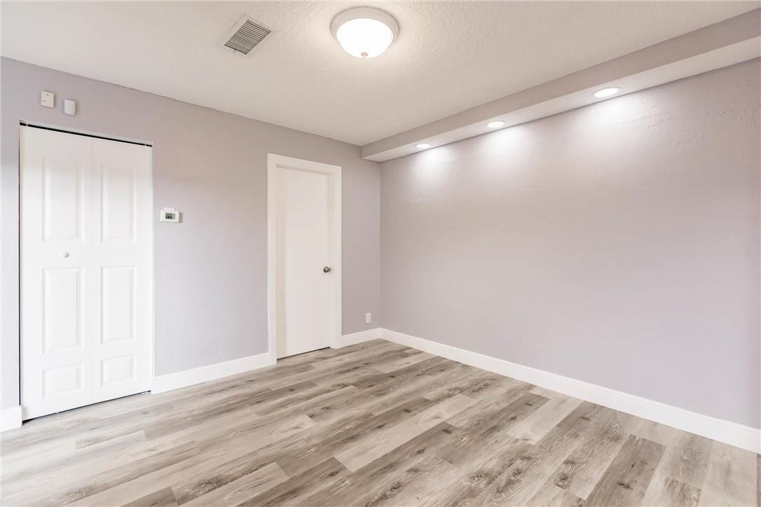 209 Woodland Road Palm Springs, FL 33461 - Photo 12 of 23 a view of empty room