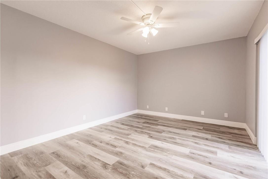 209 Woodland Road Palm Springs, FL 33461 - Photo 21 of 23 a view of an empty room