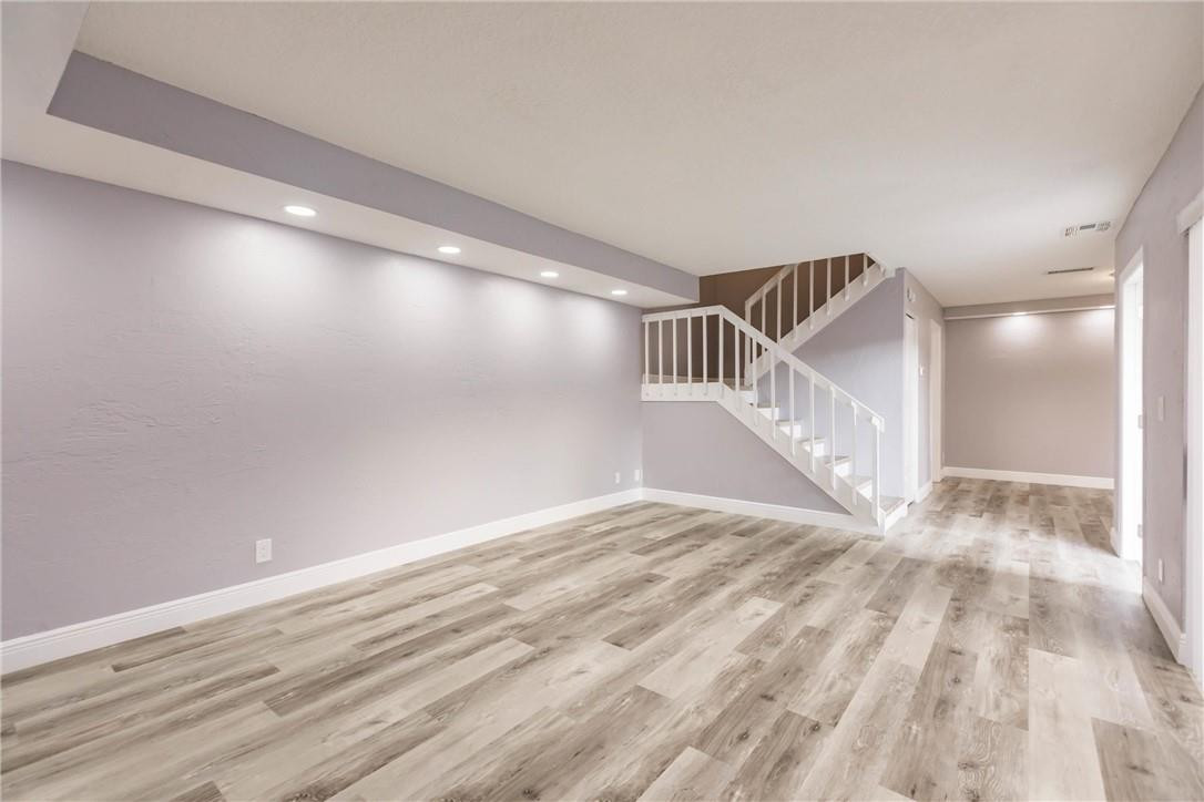 209 Woodland Road Palm Springs, FL 33461 - Photo 5 of 23 a view of entryway and hall with wooden floor