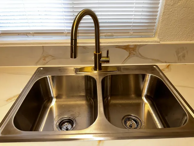 a view of water heater room with washer and dryer