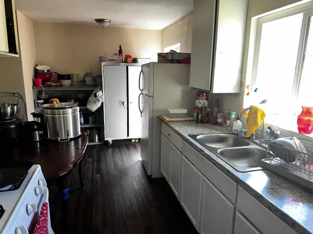 a kitchen with a sink and a stove