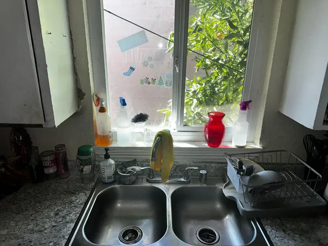 a kitchen with sink and window