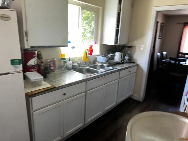 a kitchen with a sink and cabinets
