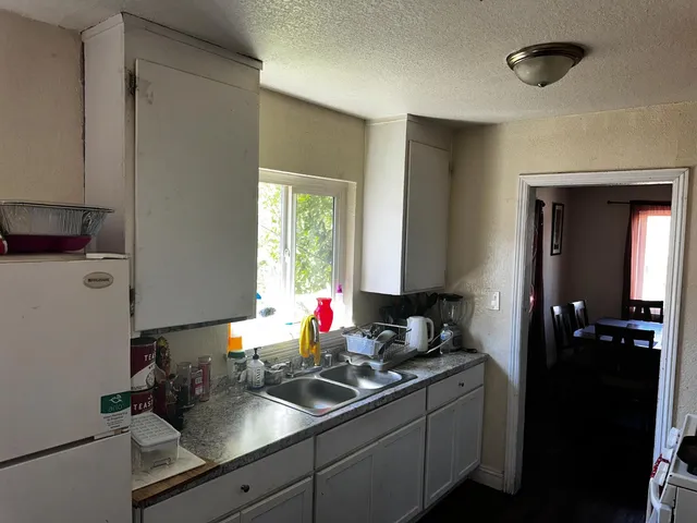 a view of a dining room with furniture and window