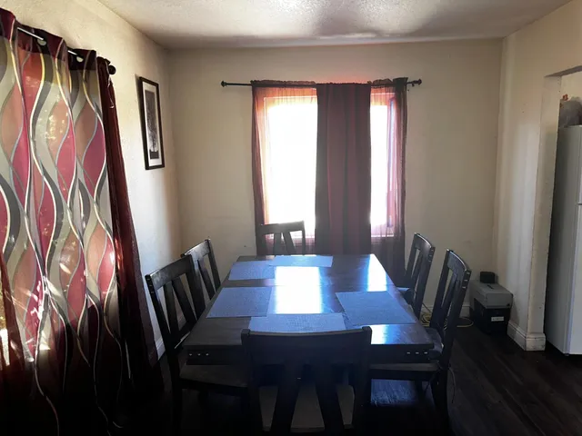 a bedroom with a bed and a cabinet