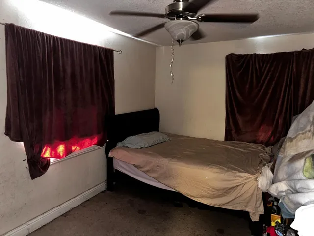 a bathroom with a toilet mirror and sink