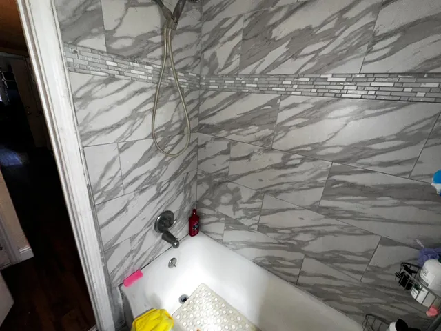 a bedroom with a bed and a chair