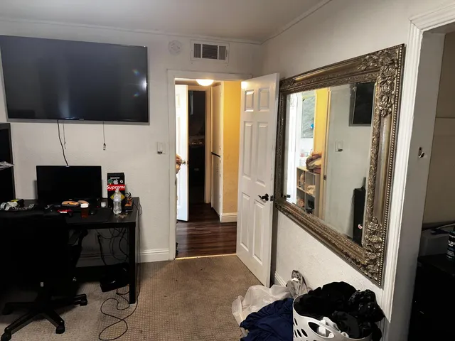 a room with furniture and a flat screen tv