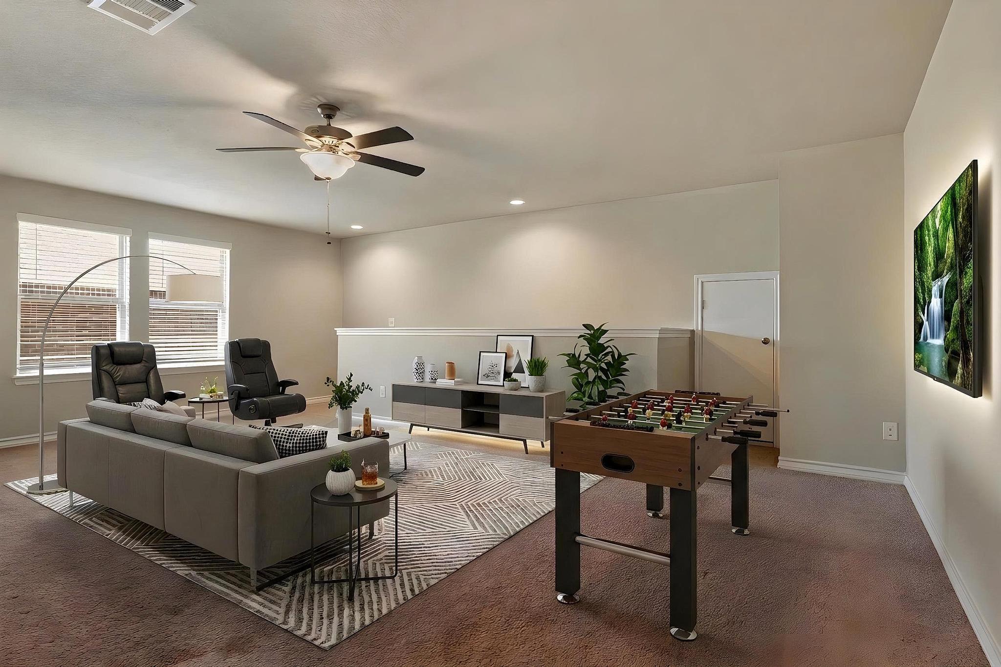 1341 Eagle Ray Street Leander, TX 78641 - Photo 5 of 37 Ample living space with comfortable seating and a fun-filled game table for entertainment.