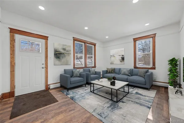 a living room with furniture and a window