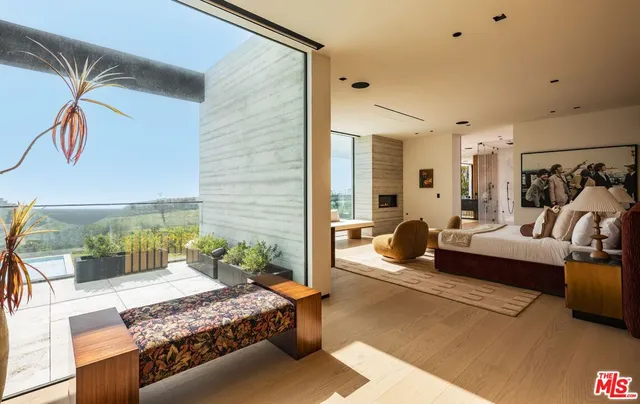a living room with a couch and a potted plant