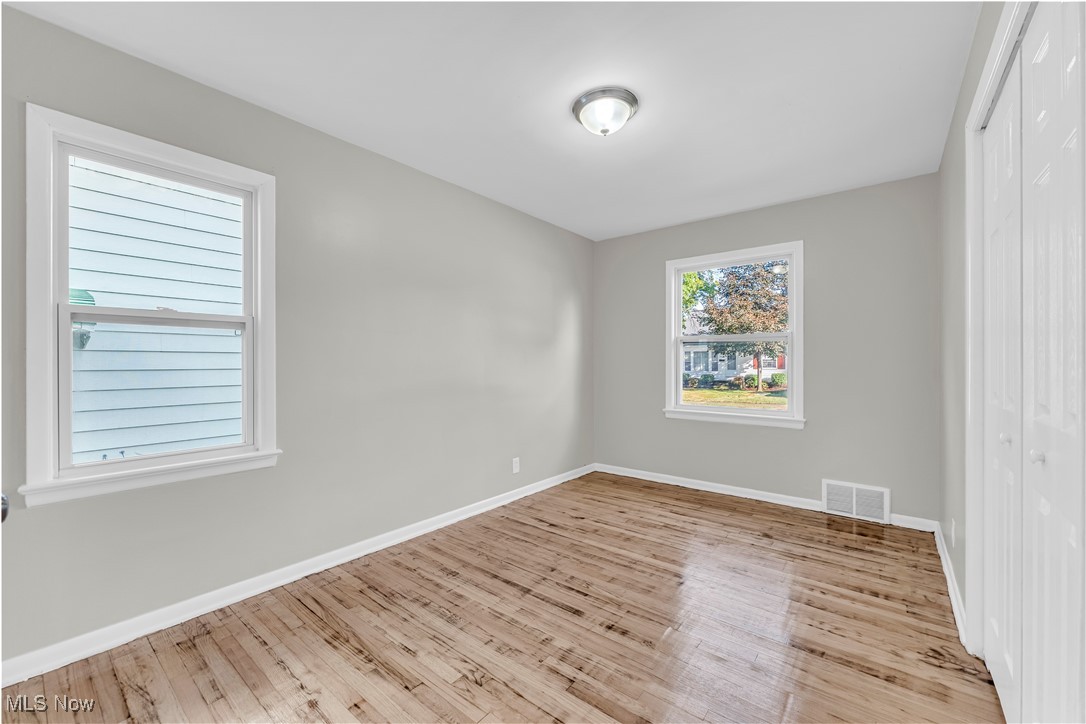 29034 Barjode Road Willowick, OH 44095 - Photo 11 of 24 Unfurnished room with light wood-style floors and baseboards