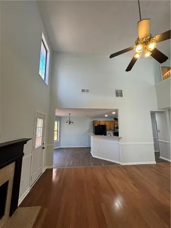a view of a kitchen with a sink and dishwasher wooden floor