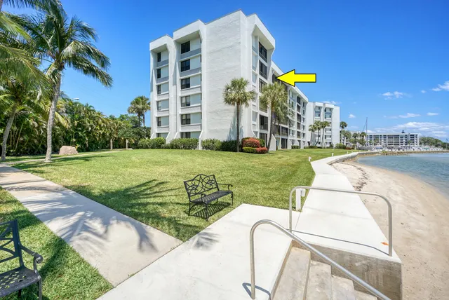 a front view of a building with a garden