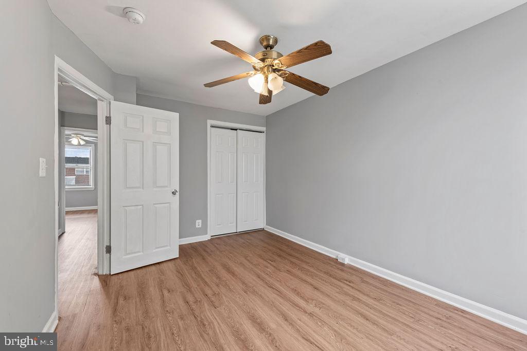 7308 Berkshire Road Baltimore, MD 21224 - Photo 17 of 40 wooden floor in an empty room with a window