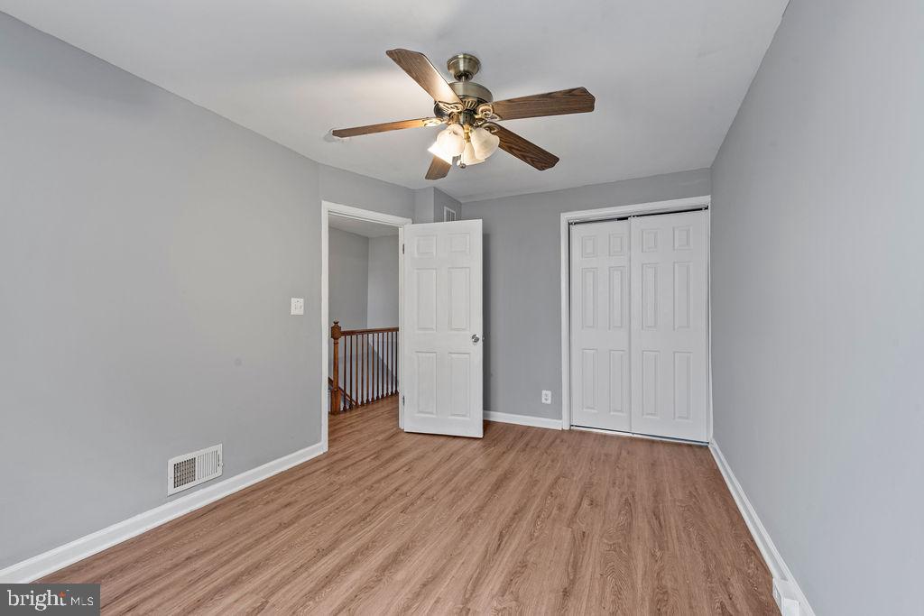 7308 Berkshire Road Baltimore, MD 21224 - Photo 18 of 40 wooden floor in an empty room with a window