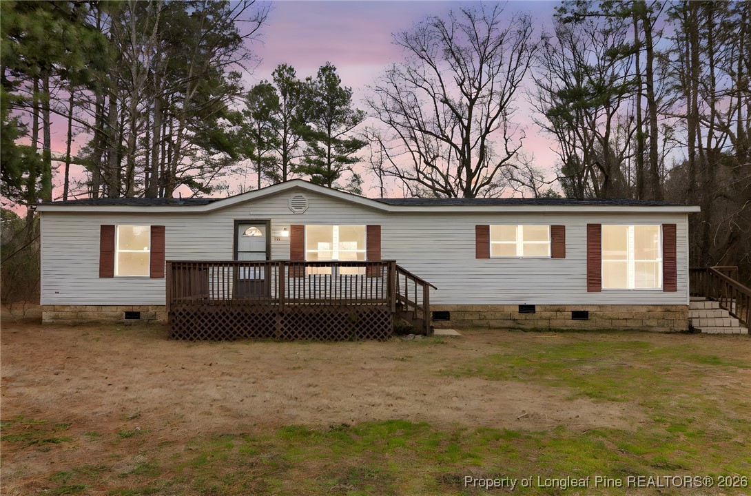 180 Branch Road Red Springs, NC 28377 - Photo 1 of 32 a front view of a house with a garden