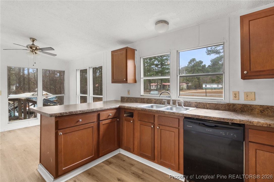 180 Branch Road Red Springs, NC 28377 - Photo 12 of 32 a kitchen with a sink stove and cabinets