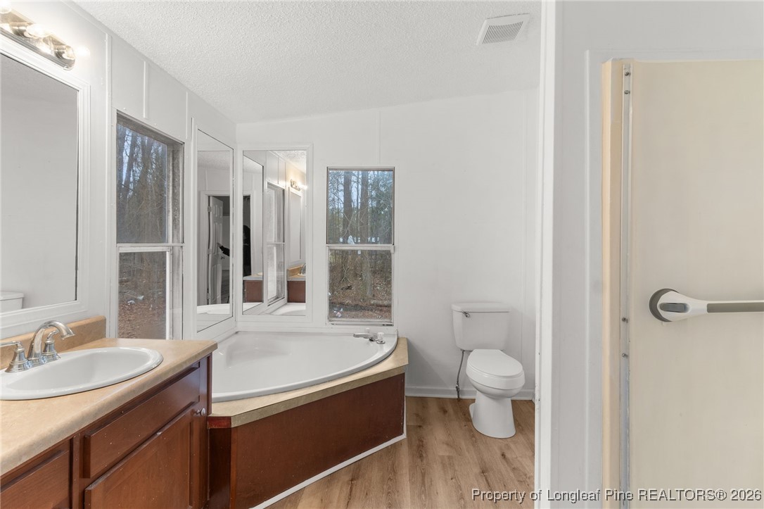 180 Branch Road Red Springs, NC 28377 - Photo 17 of 32 a bathroom with a granite countertop sink toilet and shower