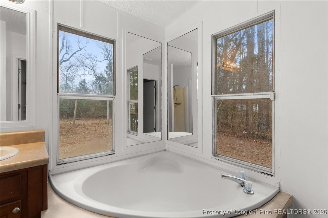 180 Branch Road Red Springs, NC 28377 - Photo 20 of 32 workspace with wooden floor and outdoor view