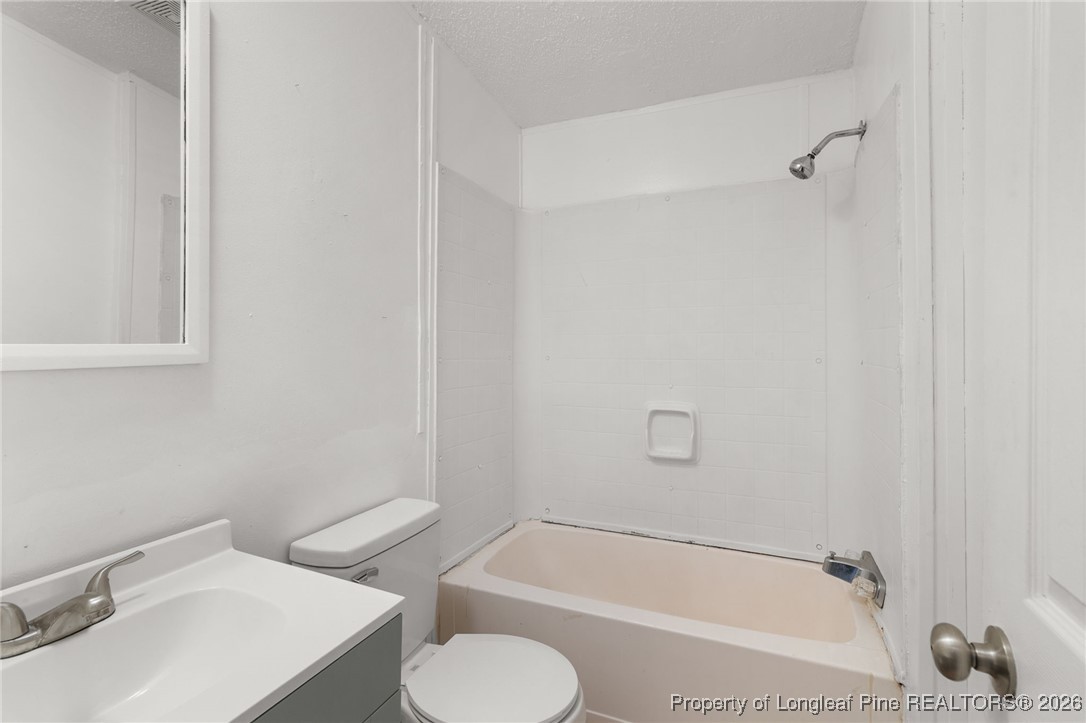 180 Branch Road Red Springs, NC 28377 - Photo 24 of 32 a bathroom with a sink toilet and shower