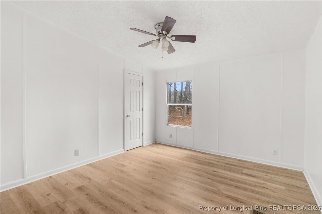 180 Branch Road Red Springs, NC 28377 - Photo 26 of 32 a view of empty room with window and ceiling fan