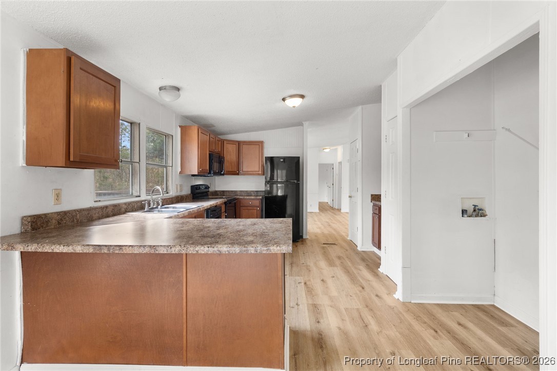 180 Branch Road Red Springs, NC 28377 - Photo 10 of 32 a kitchen with stainless steel appliances granite countertop a granite counter tops and a refrigerator