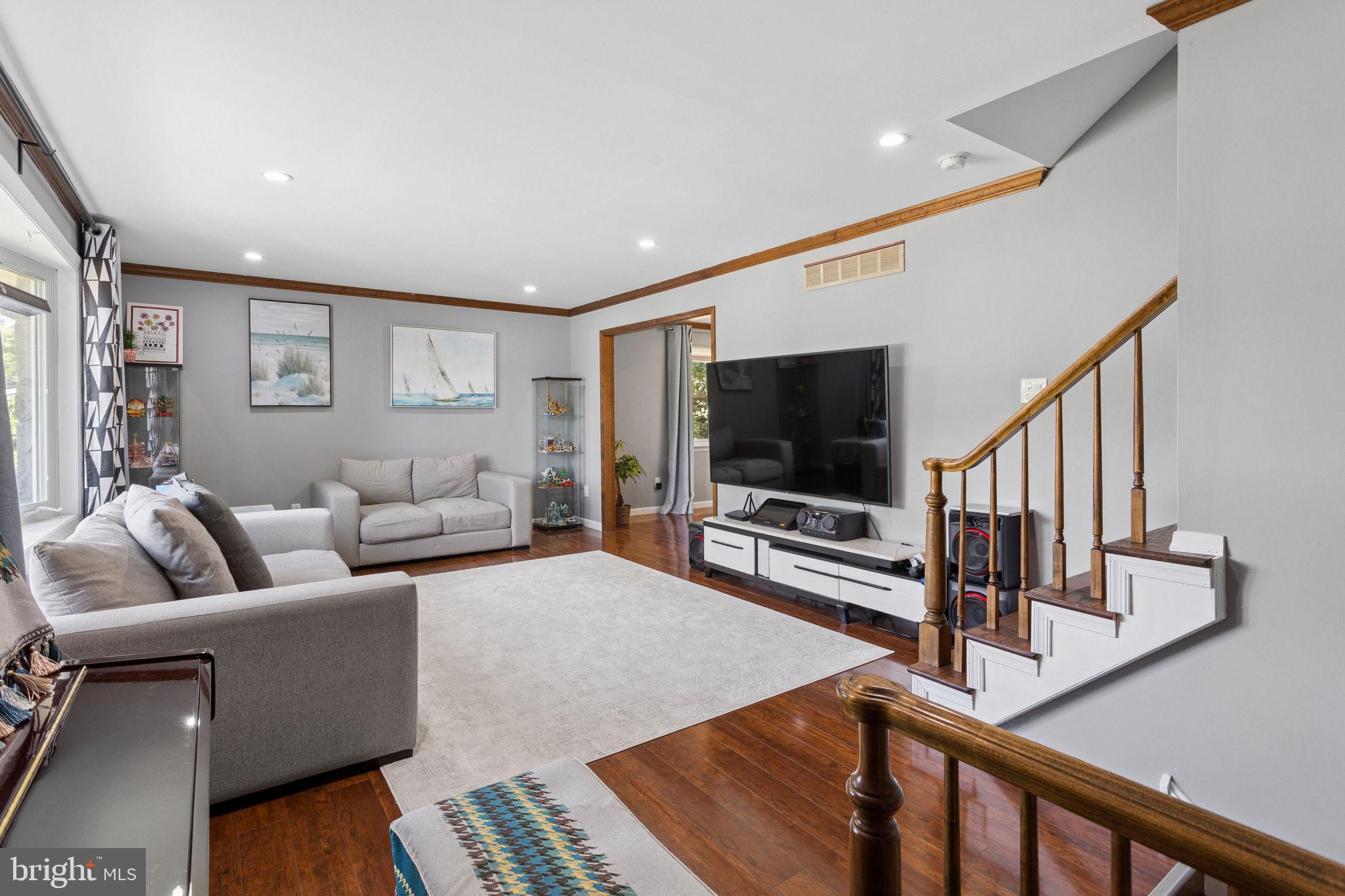 252 Sandringham Road Cherry Hill, NJ 08003 - Photo 6 of 31 a living room with furniture and a flat screen tv