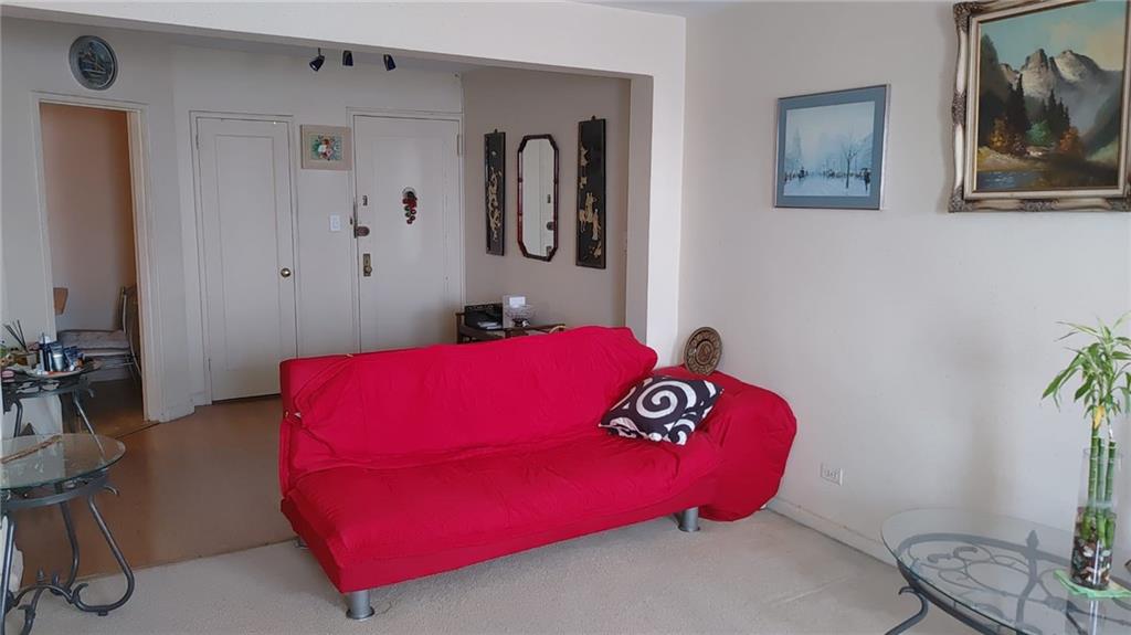 2465 Haring Street, Unit 3E Brooklyn, NY 11235 - Photo 2 of 6 a bedroom with a bed and painting on the wall