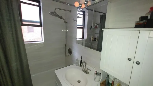 a bathroom with a sink and a mirror