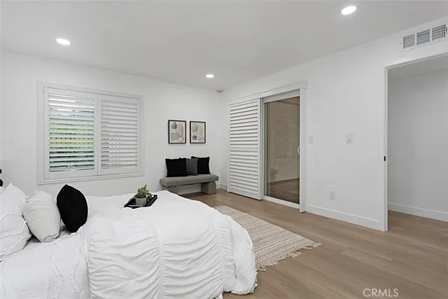 a bedroom with a bed and a television