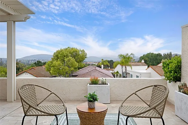 a view of a chairs and table in the terrace