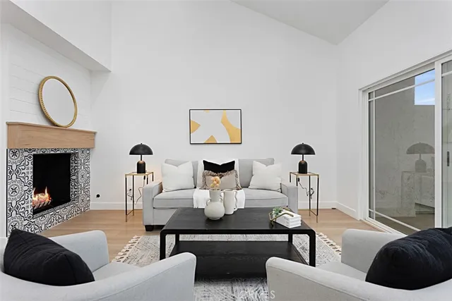 a living room with furniture and a fireplace