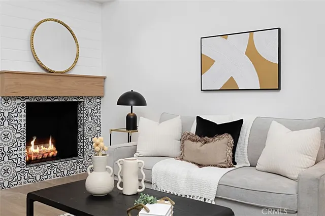 a living room with furniture a fireplace and wall