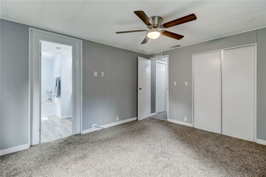 540821 Lem Turner Road Callahan, FL 32011 - Photo 24 of 35 an empty room to hallway with a ceiling fan