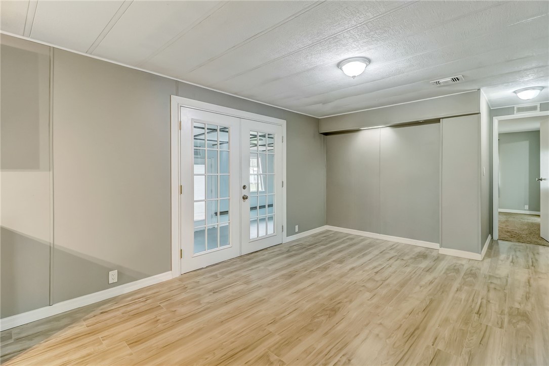 540821 Lem Turner Road Callahan, FL 32011 - Photo 6 of 35 a view of an empty room with wooden floor and a window