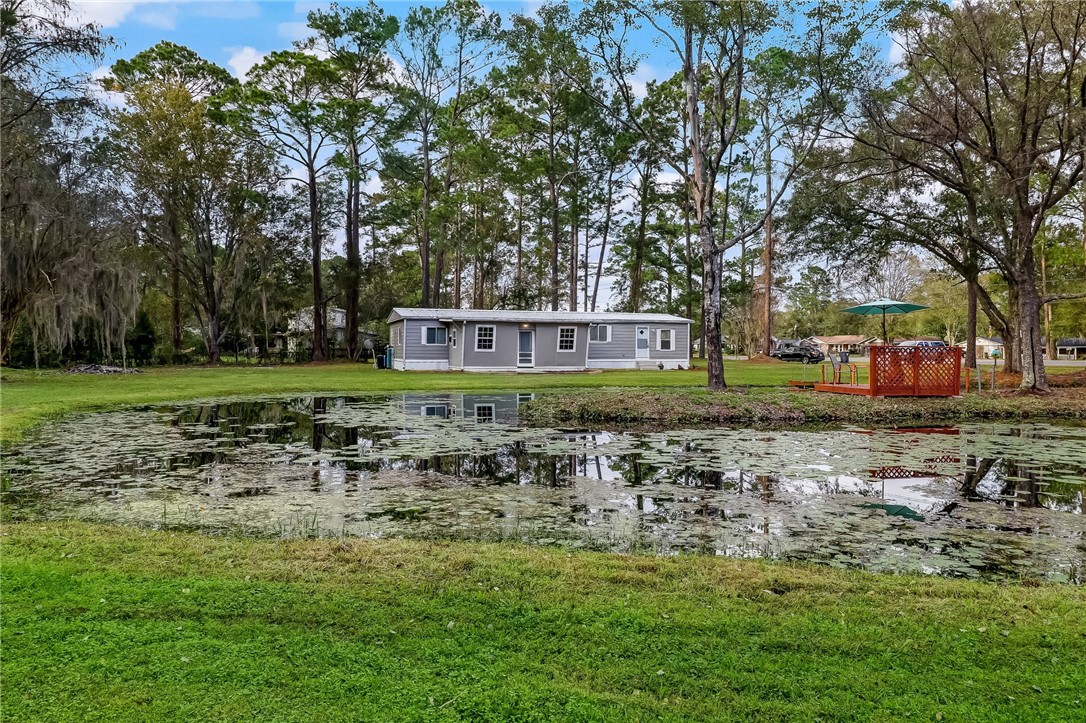 540821 Lem Turner Road Callahan, FL 32011 - Photo 7 of 35 a view of a house with a yard and sitting area