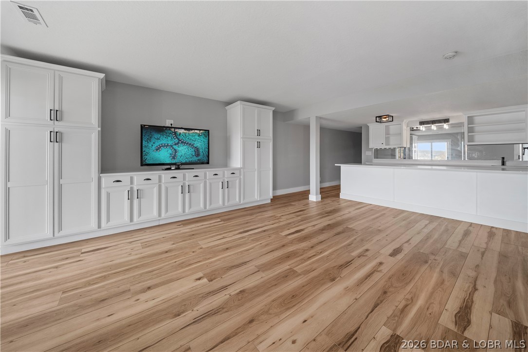 2180 Bittersweet Road Lake Ozark, MO 65049 - Photo 3 of 59 Full Basement w/ Custom Cabinetry & Kitchen