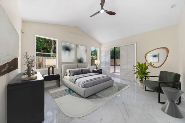 a living room with furniture chandelier and a window